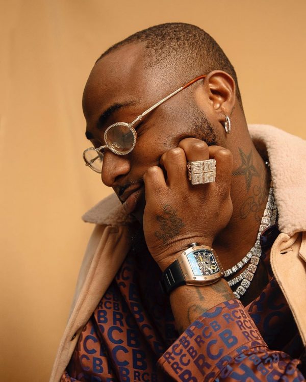 Davido Distributes Money to people around his home in Lekki