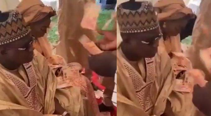 Nigerians react to viral video of couple being sprayed ₦10 Notes by their at their wedding