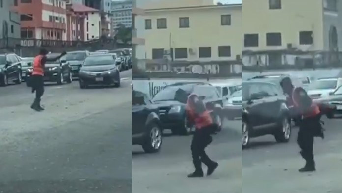 Happiness Is Free!!! Happy Policeman filmed dancing leg work while controlling traffic (Video)