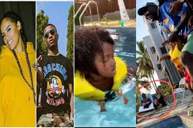 See Wizkid's reaction as man throws his son "Zion" into a swimming pool (video)